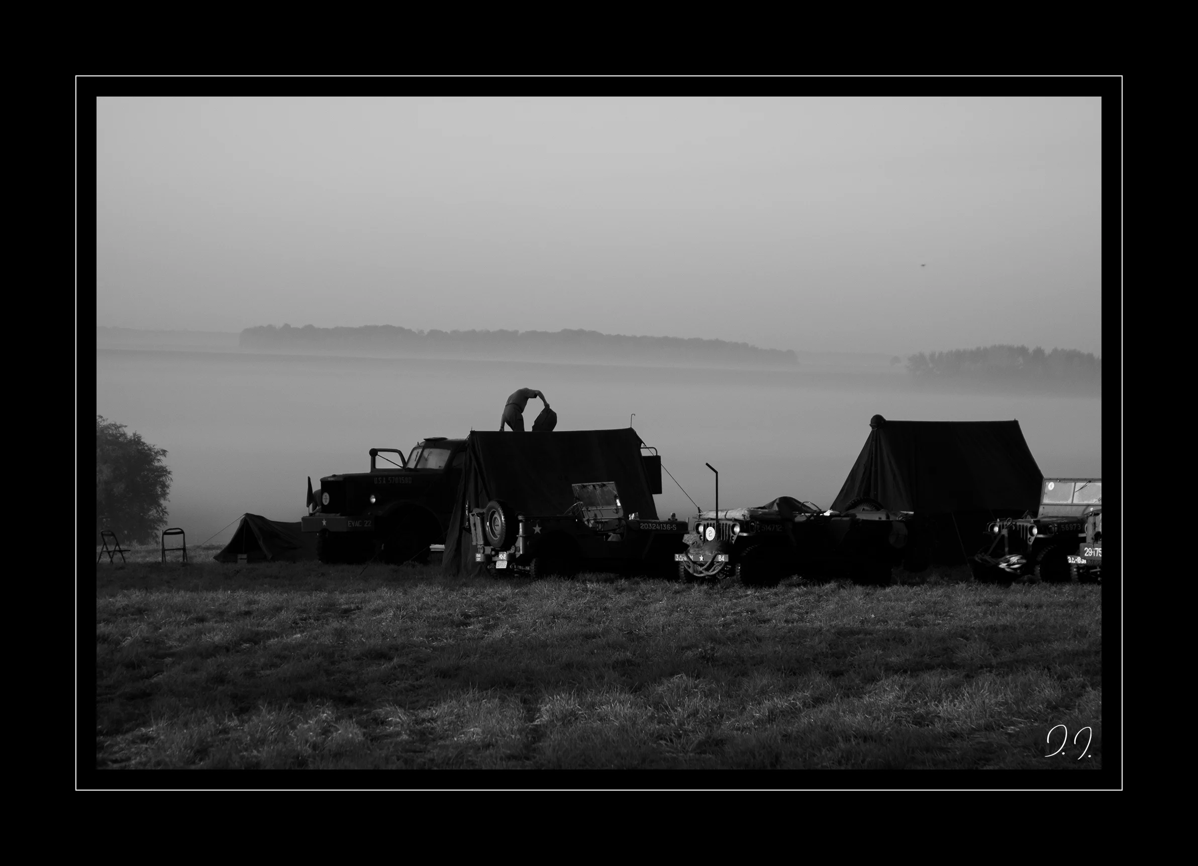 Encampment of a military convoy in the mist at dusk, historical re-enactment, 2013.